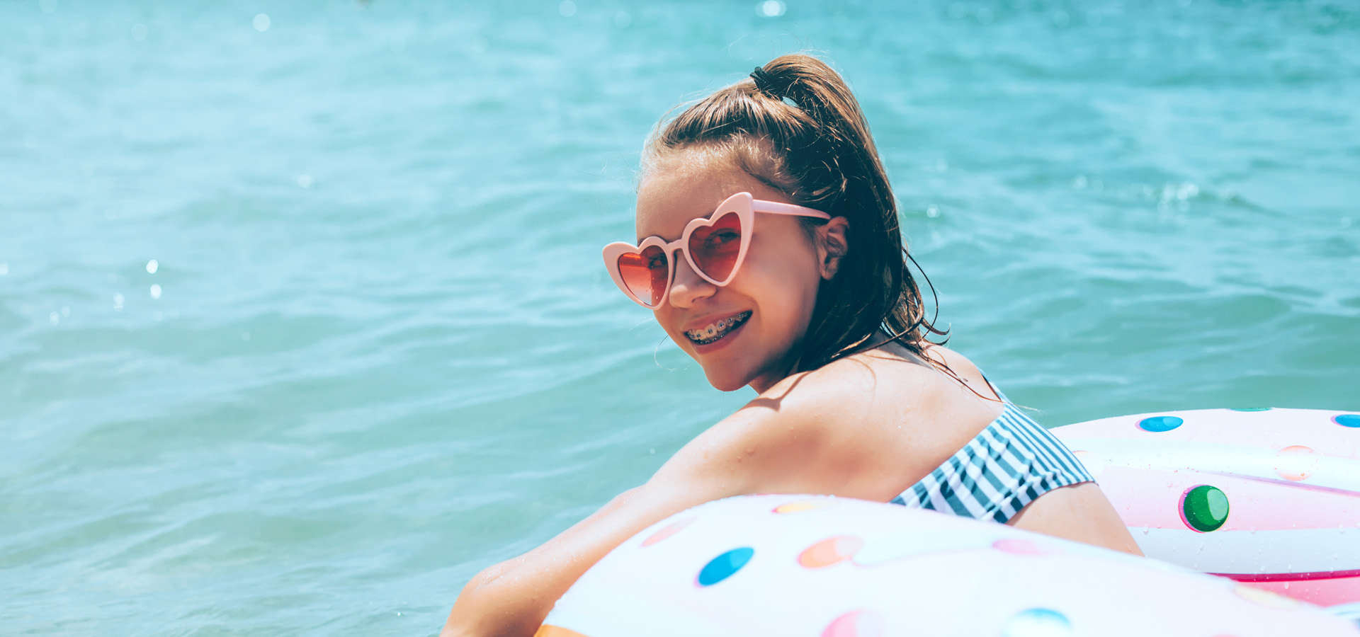 Girl with braces enjoying a vacation at the beach in Fort Lauderdale, FL.