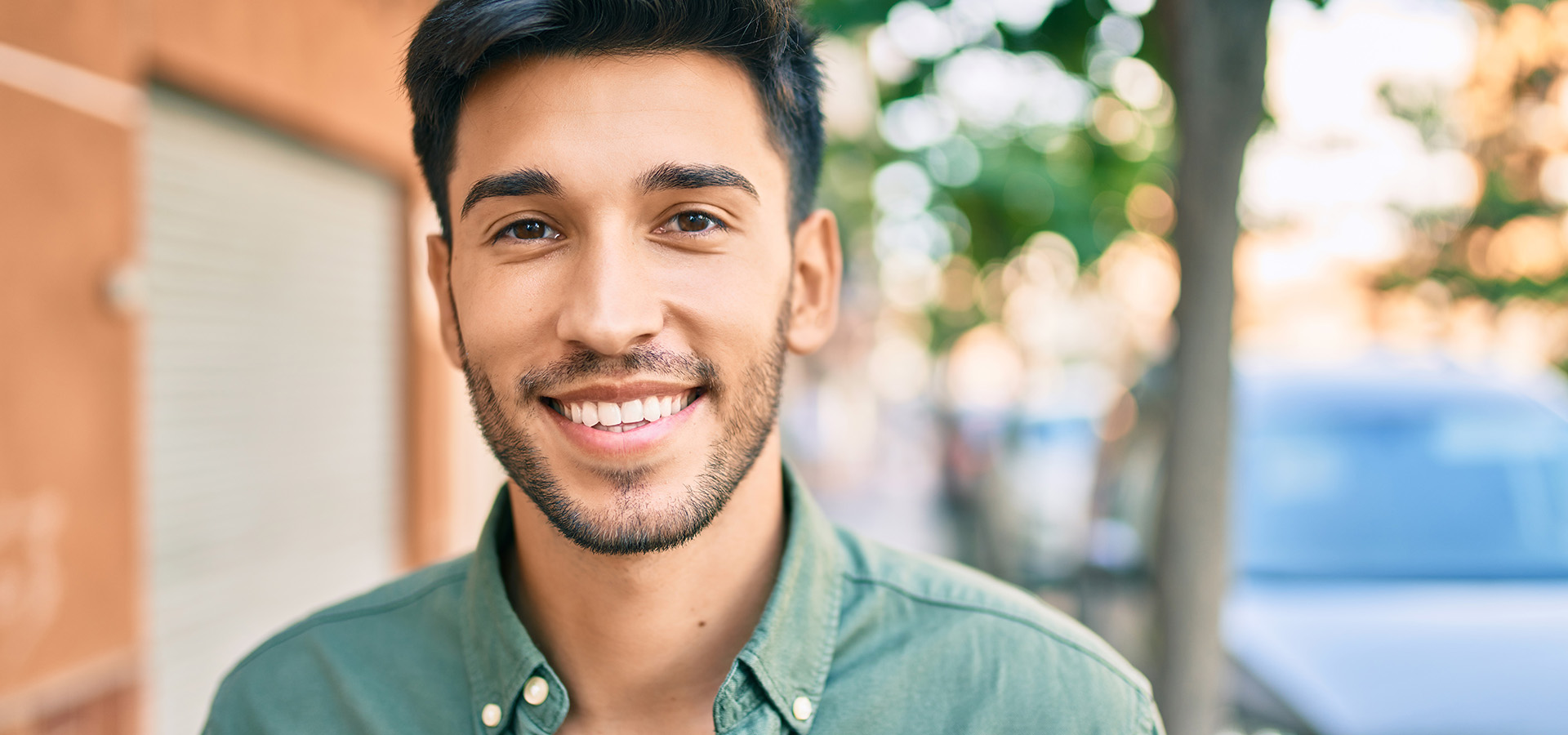 Young latin man smiling