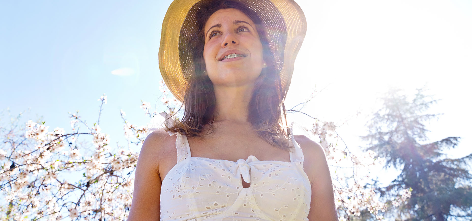 Woman with braces, springtime pollen.
